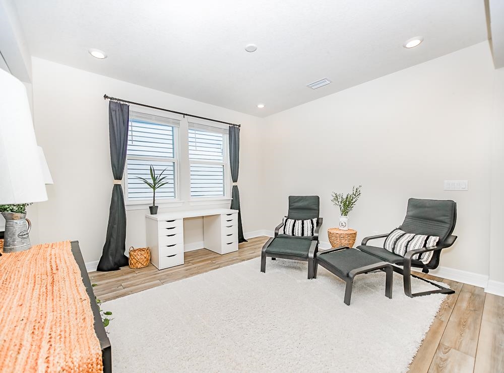 233 Red Barn Road St. Augustine, FL 32092 - Photo 21 of 40 a bedroom with a bed and a desk