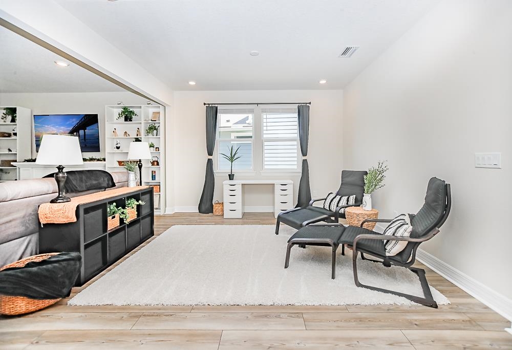 233 Red Barn Road St. Augustine, FL 32092 - Photo 22 of 40 a view of a workspace with furniture and a window