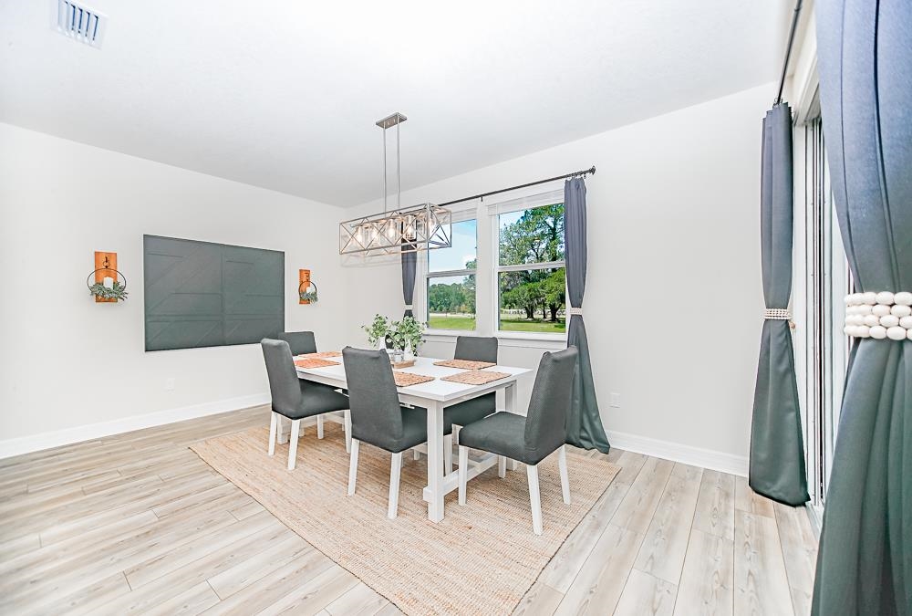 233 Red Barn Road St. Augustine, FL 32092 - Photo 25 of 40 a view of a dining room with furniture window and outside view