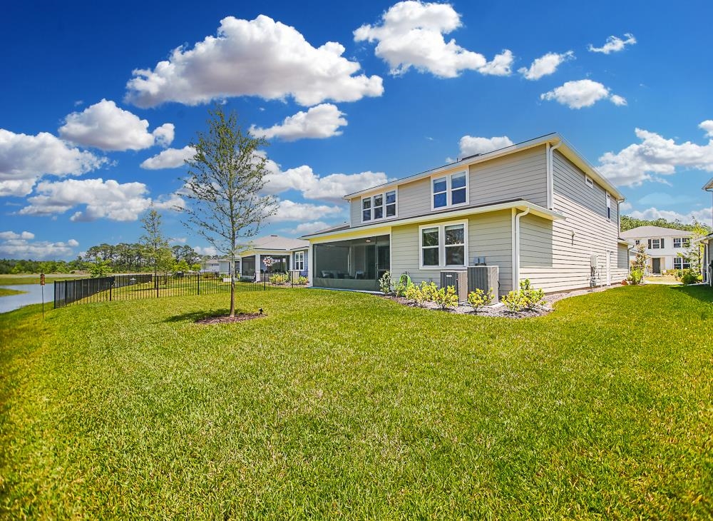 233 Red Barn Road St. Augustine, FL 32092 - Photo 31 of 40 a front view of a house with swimming pool having outdoor seating