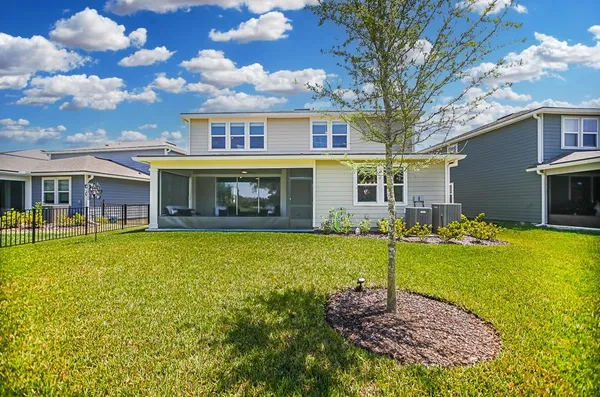 a view of a house with a yard