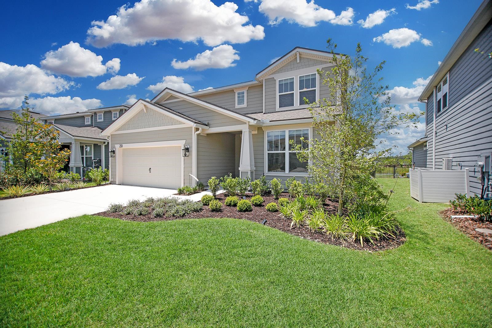 233 Red Barn Road St. Augustine, FL 32092 - Photo 33 of 40 a front view of a house with a garden
