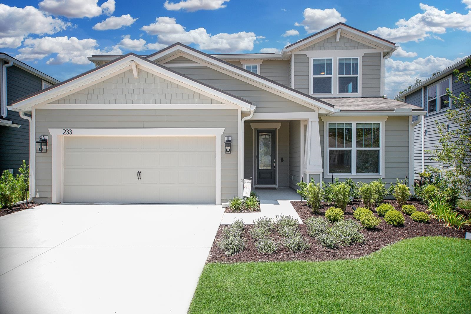 233 Red Barn Road St. Augustine, FL 32092 - Photo 36 of 40 a front view of a house with a garden and plants