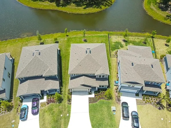 an aerial view of a house with a swimming pool