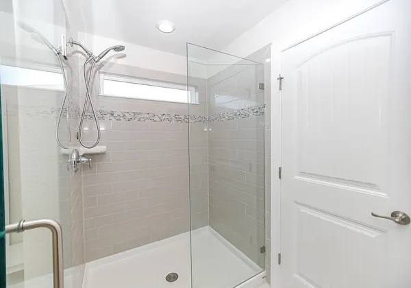 a bathroom with a shower and a tub