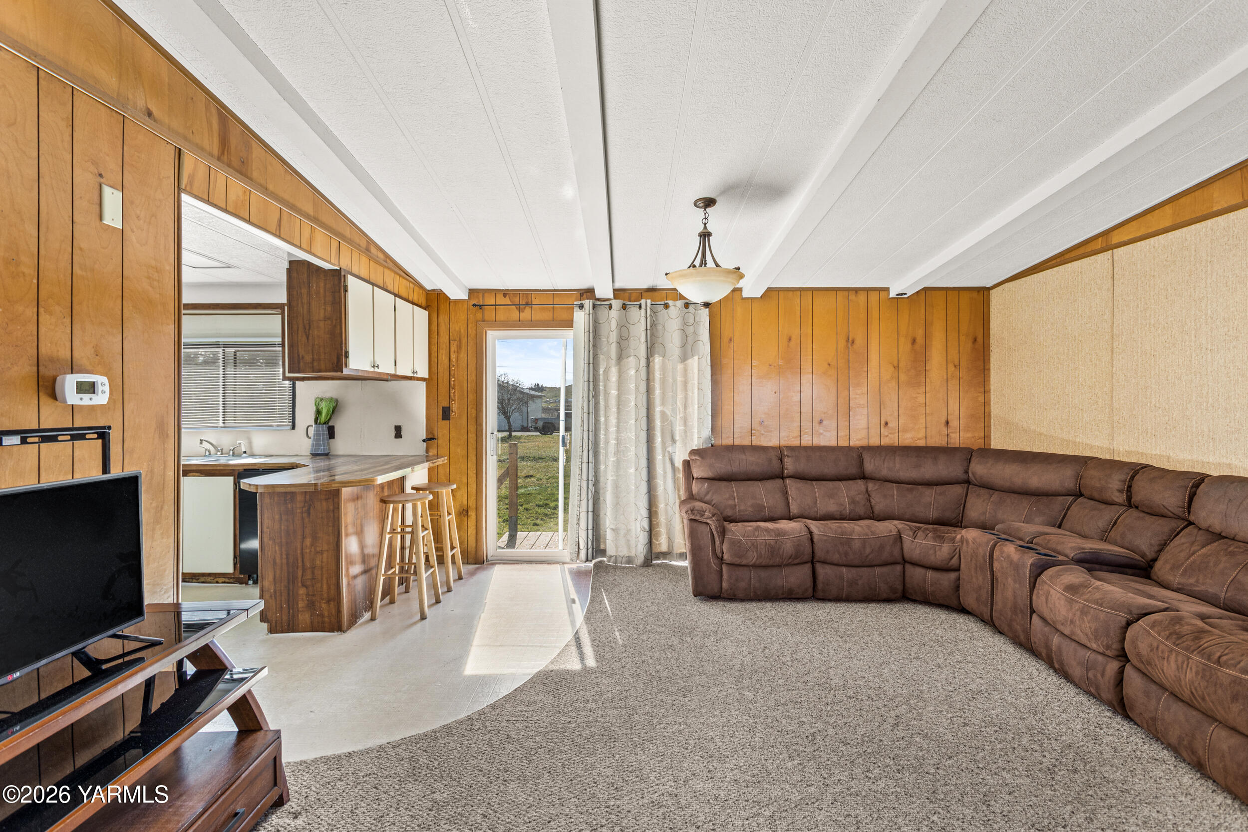 142 Foster Lane Selah, WA 98942 - Photo 8 of 21 a living room with furniture and a flat screen tv