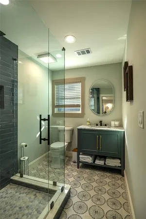 a bathroom with a mirror a sink and a mirror