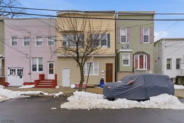 a front view of a building with parking space