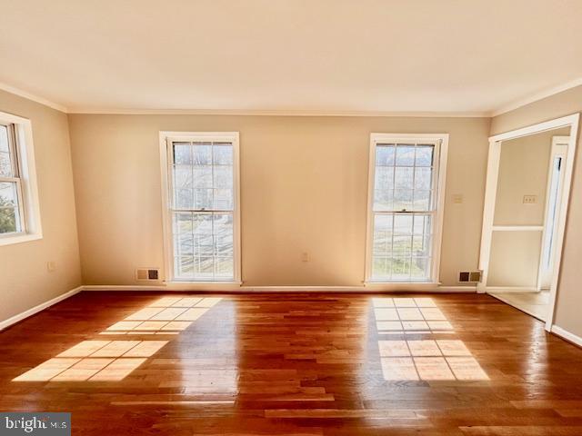 1409 Winding Waye Lane Silver Spring, MD 20902 - Photo 11 of 73 a view of an empty room with window and wooden floor