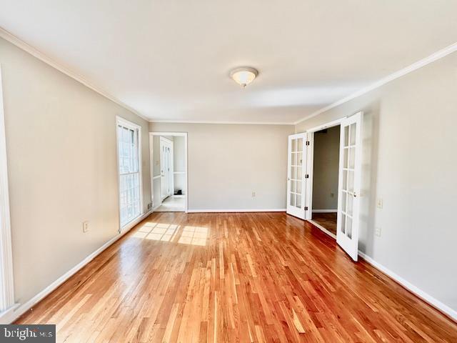 1409 Winding Waye Lane Silver Spring, MD 20902 - Photo 12 of 73 a view of an empty room with wooden floor and a window