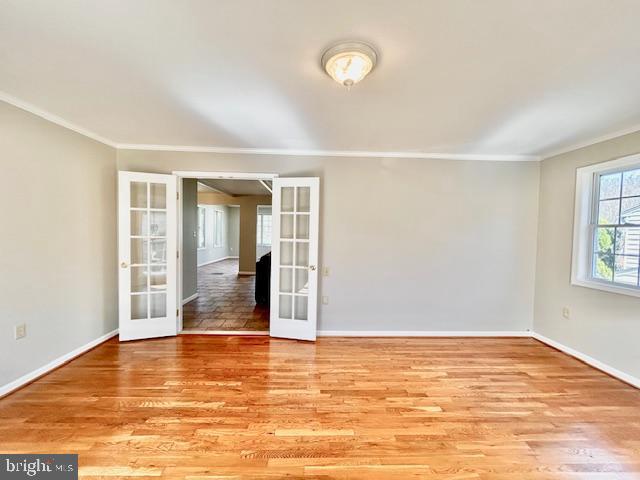 1409 Winding Waye Lane Silver Spring, MD 20902 - Photo 13 of 73 an empty room with window and wooden floor