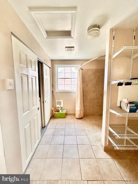 1409 Winding Waye Lane Silver Spring, MD 20902 - Photo 26 of 73 a view of a hallway to an empty room with a fireplace and a window