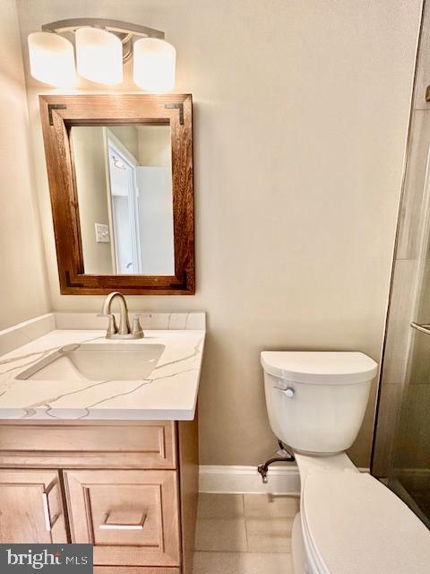 1409 Winding Waye Lane Silver Spring, MD 20902 - Photo 33 of 73 a bathroom with a toilet a sink and mirror