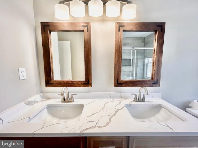 1409 Winding Waye Lane Silver Spring, MD 20902 - Photo 43 of 73 a bathroom with sink granite and a mirror