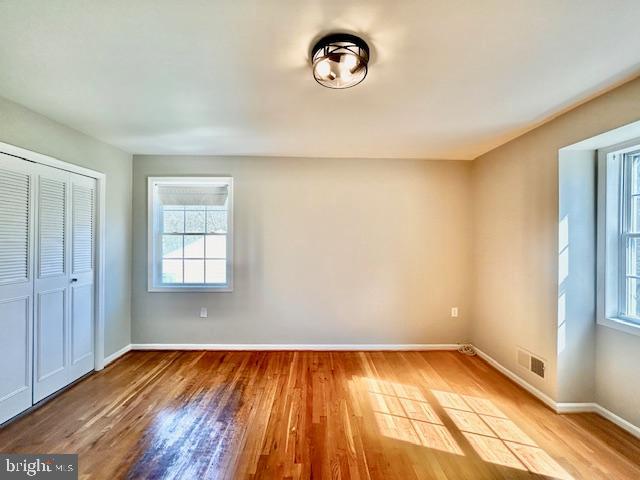 1409 Winding Waye Lane Silver Spring, MD 20902 - Photo 49 of 73 a view of a room with wooden floor and a window
