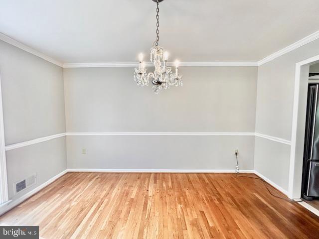 1409 Winding Waye Lane Silver Spring, MD 20902 - Photo 5 of 73 a view of a room with wooden floor and chandelier