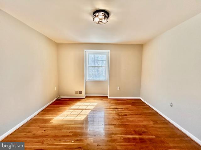 1409 Winding Waye Lane Silver Spring, MD 20902 - Photo 51 of 73 a view of an empty room with a window