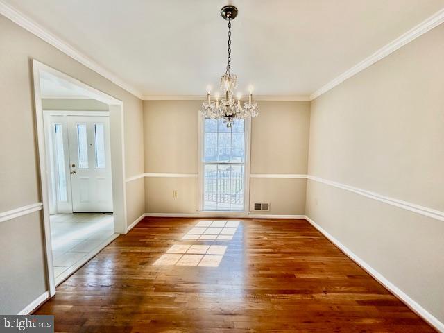 1409 Winding Waye Lane Silver Spring, MD 20902 - Photo 6 of 73 a view of livingroom with hardwood floor and kitchen view