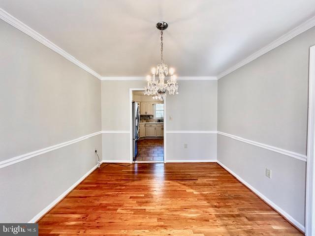 1409 Winding Waye Lane Silver Spring, MD 20902 - Photo 9 of 73 a view of a room with wooden floor and chandelier