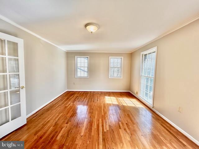 1409 Winding Waye Lane Silver Spring, MD 20902 - Photo 10 of 73 an empty room with wooden floor and windows