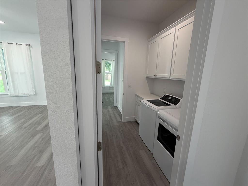 4200 Williams Road Bellmead, TX 76705 - Photo 19 of 22 a kitchen with a stove and white cabinets