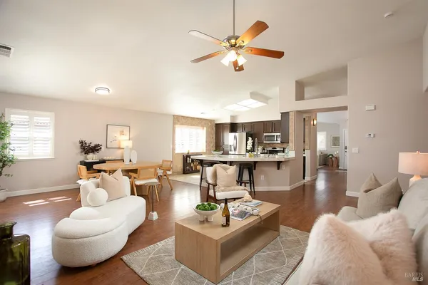 a view of a dining room with furniture window and wooden floor