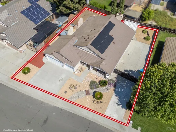 an aerial view of a house with swimming pool and ocean view