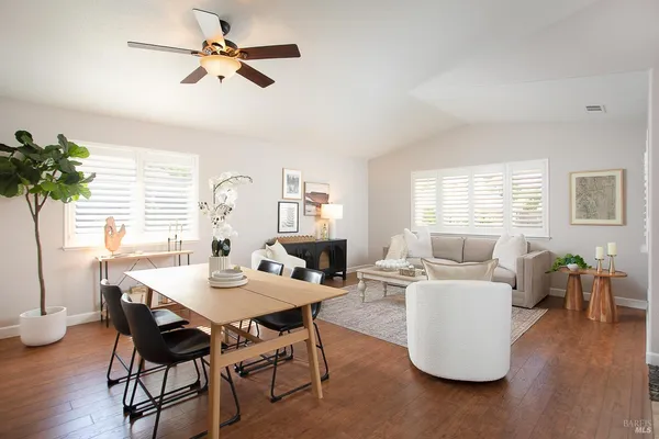 a view of a dining room with furniture window and wooden floor