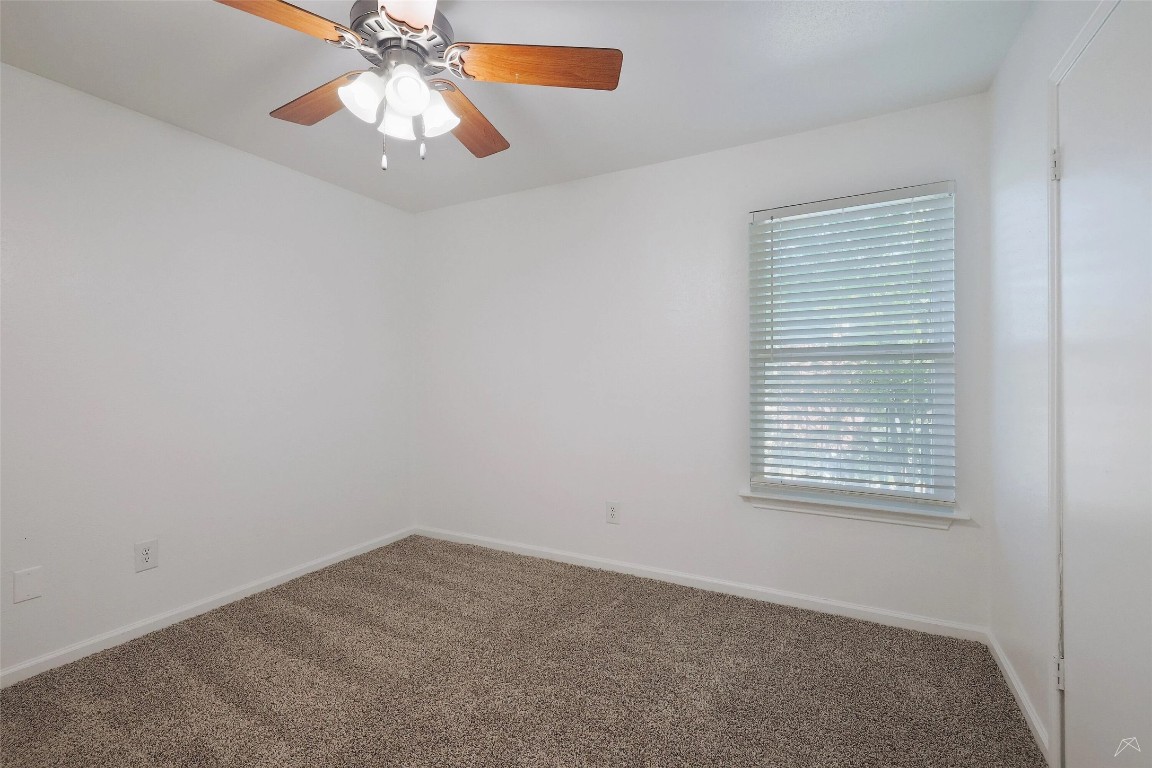 2323 Wells Branch Parkway, Unit A205 Austin, TX 78728 - Photo 10 of 22 an empty room with a window and a fan