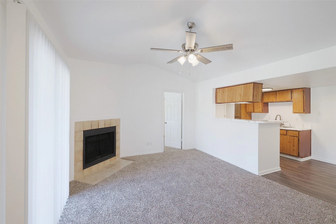 2323 Wells Branch Parkway, Unit A205 Austin, TX 78728 - Photo 4 of 22 a view of an empty room with a kitchen
