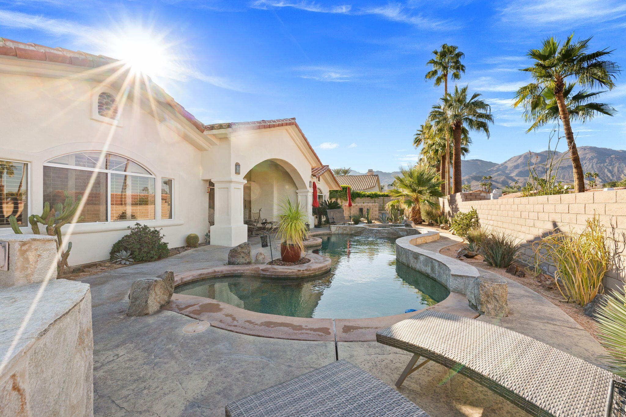 73110 Calliandra Street Palm Desert, CA 92260 - Photo 1 of 67 a view of a house with backyard and swimming pool