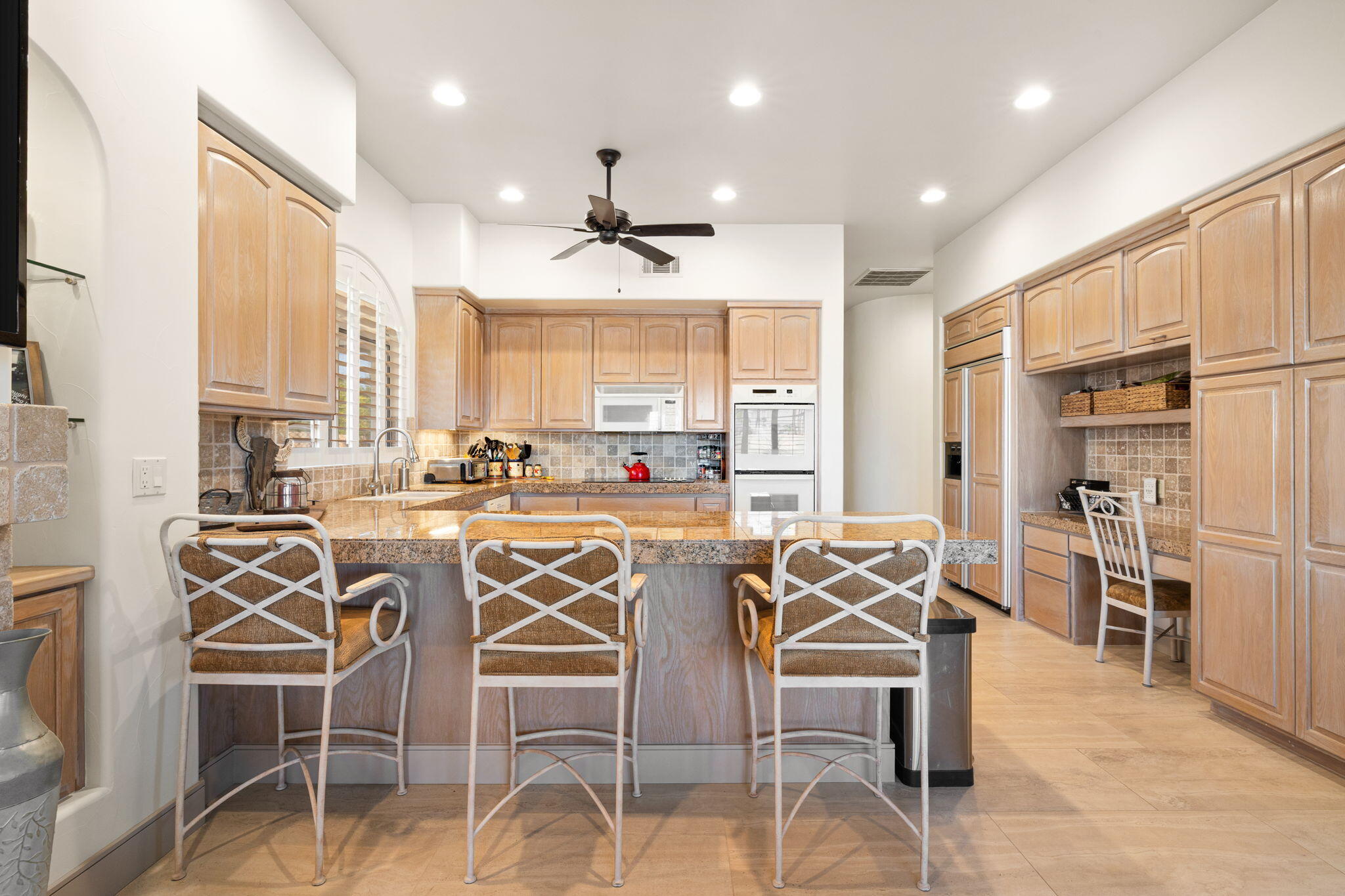 73110 Calliandra Street Palm Desert, CA 92260 - Photo 17 of 67 a view of a dining room kitchen and windows