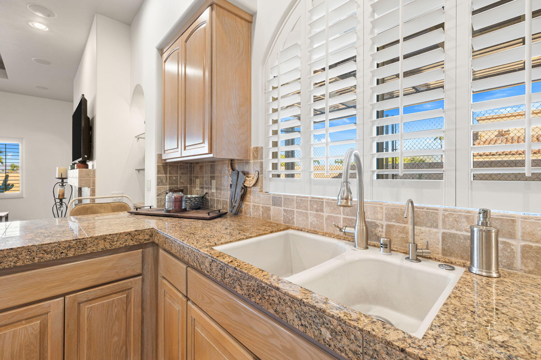 73110 Calliandra Street Palm Desert, CA 92260 - Photo 20 of 67 a kitchen with granite countertop a sink and a stove