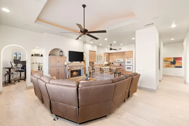 a view of a workspace with furniture and a bathroom