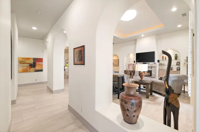 a bedroom with a bed and a flat tv screen