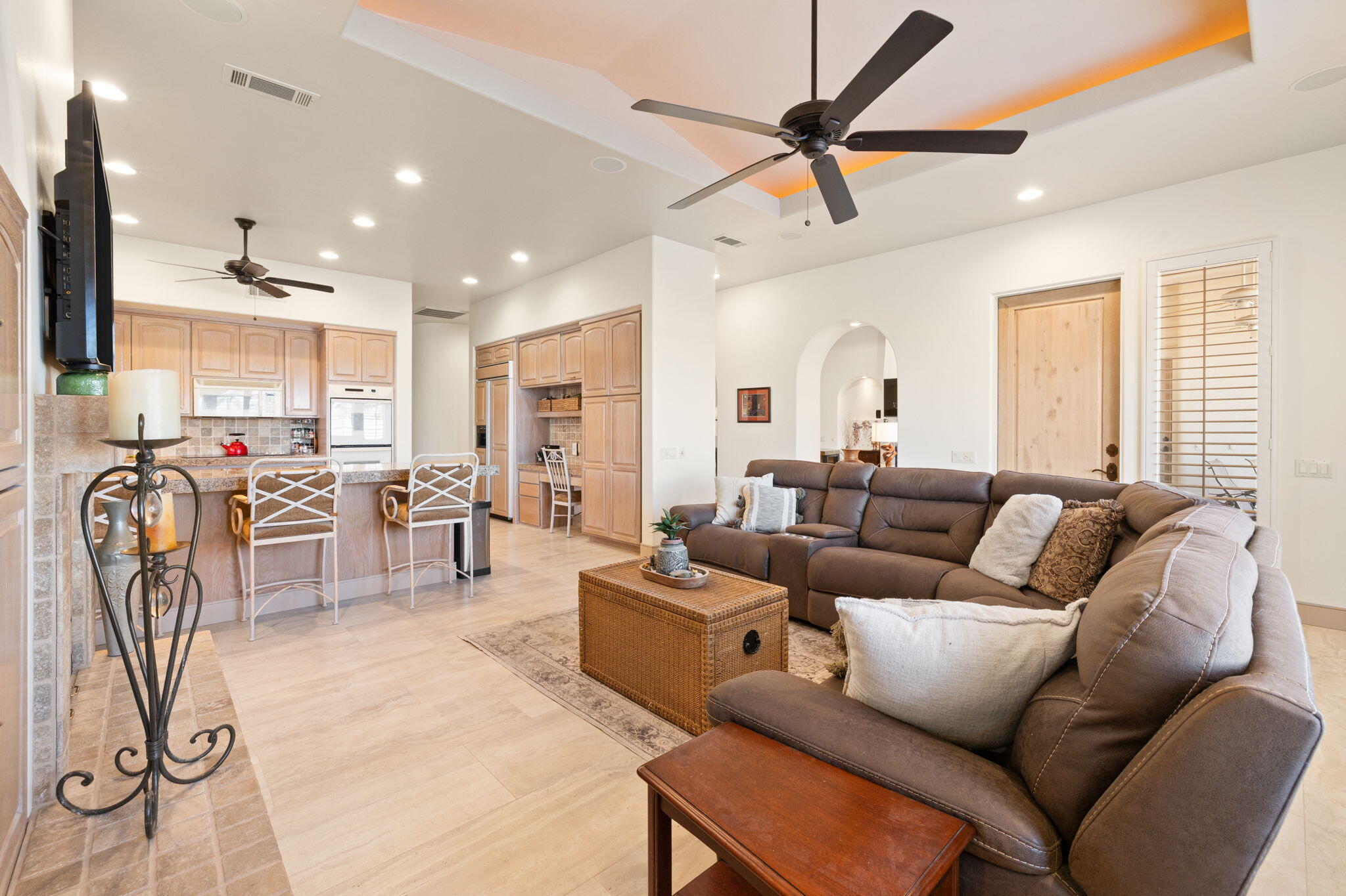 73110 Calliandra Street Palm Desert, CA 92260 - Photo 28 of 67 a living room with furniture a table and a flat screen tv