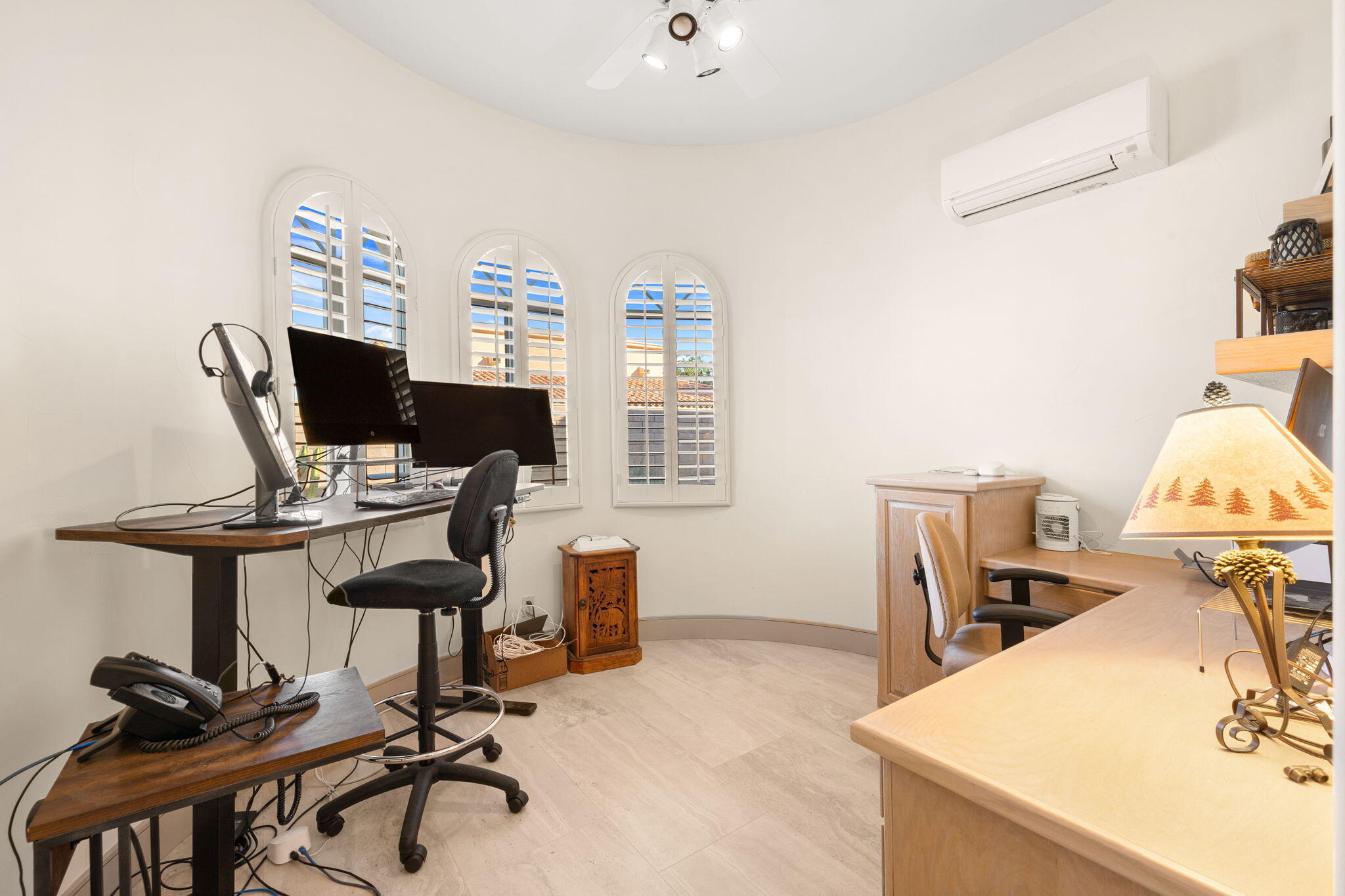 73110 Calliandra Street Palm Desert, CA 92260 - Photo 30 of 67 a view of a workspace with furniture and a bathroom
