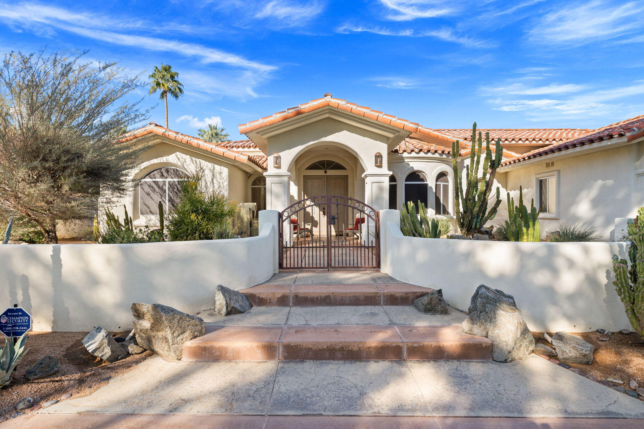 73110 Calliandra Street Palm Desert, CA 92260 - Photo 3 of 67 a front view of a house with a yard