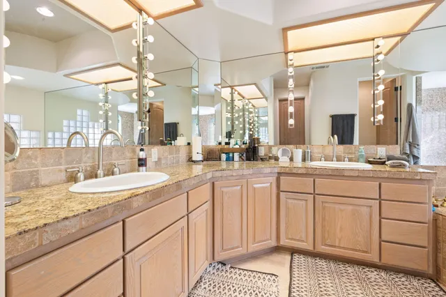 a view of a swimming pool and lounge chair