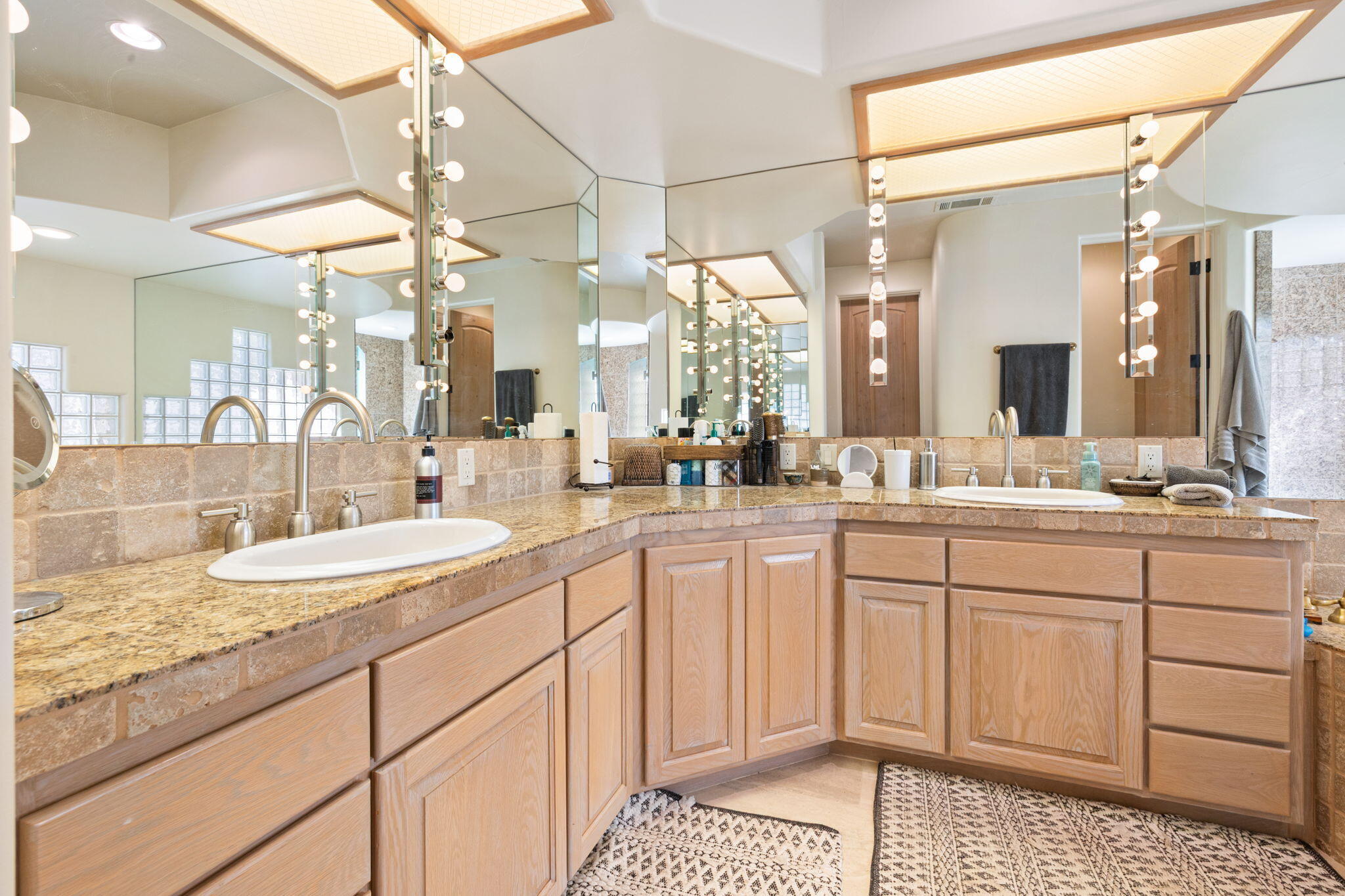 73110 Calliandra Street Palm Desert, CA 92260 - Photo 38 of 67 a bathroom with a sink vanity and a mirror