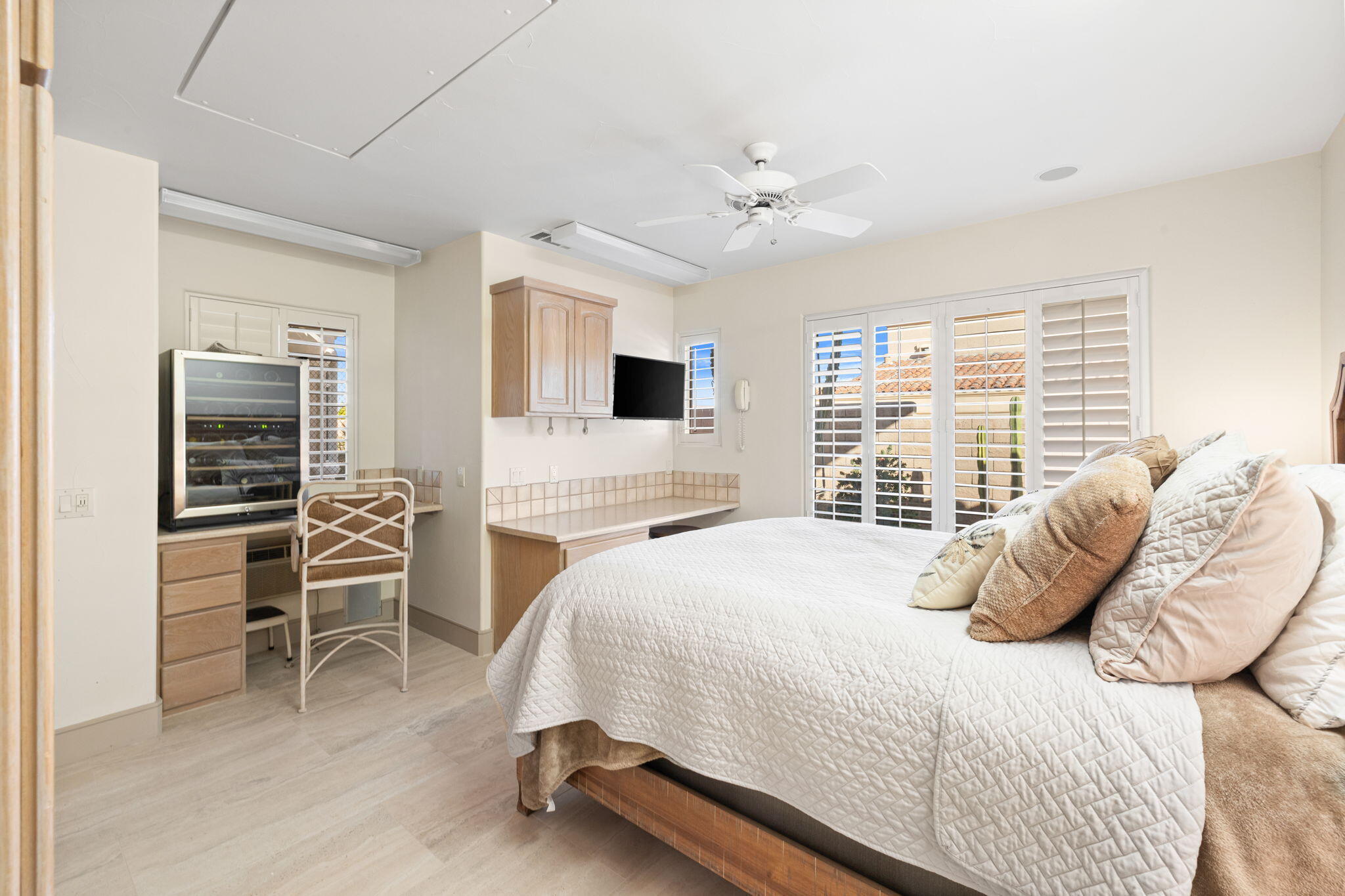 73110 Calliandra Street Palm Desert, CA 92260 - Photo 41 of 67 a bedroom with a bed and a chandelier