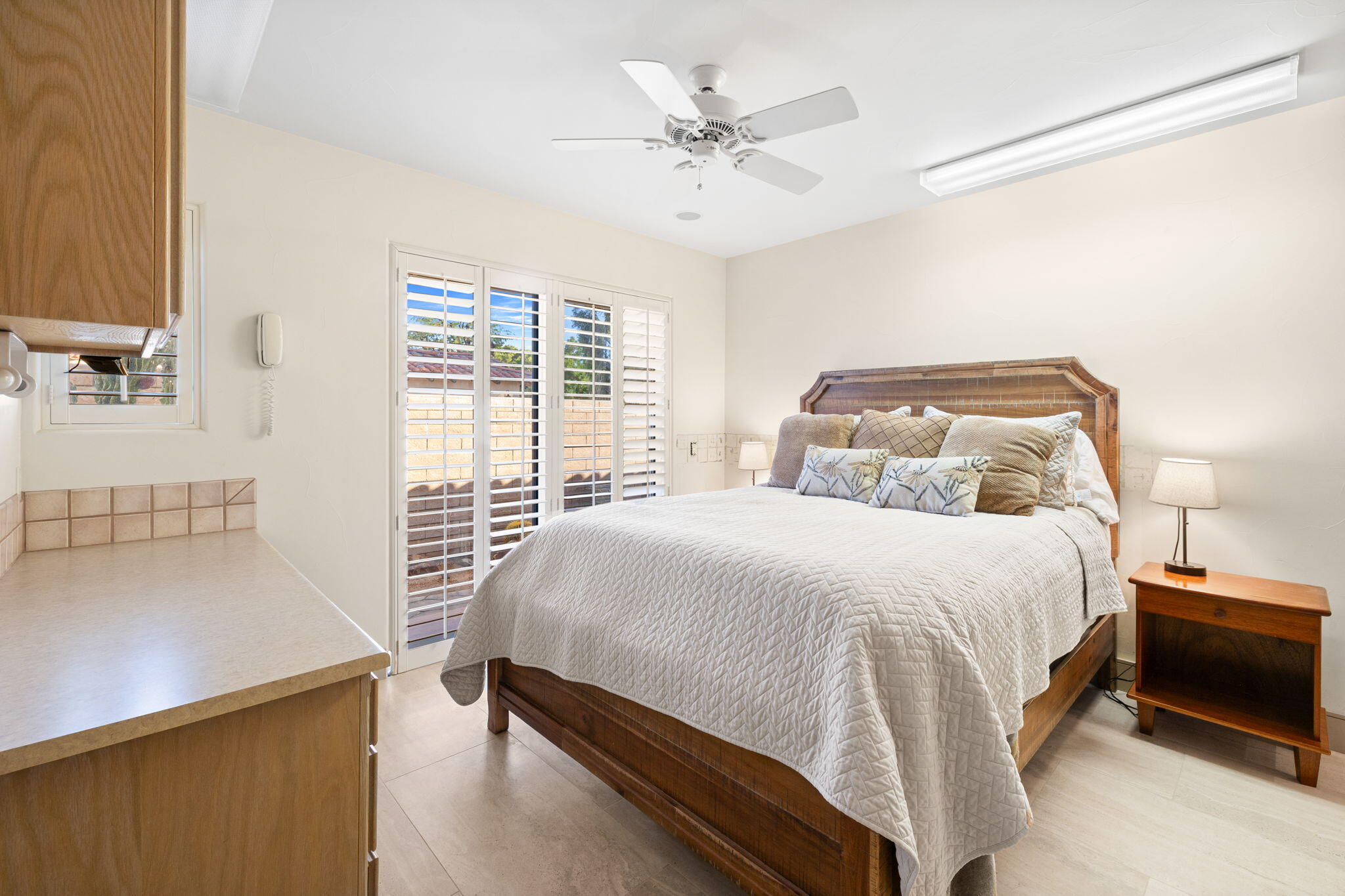 73110 Calliandra Street Palm Desert, CA 92260 - Photo 42 of 67 a bedroom with a bed and a large window