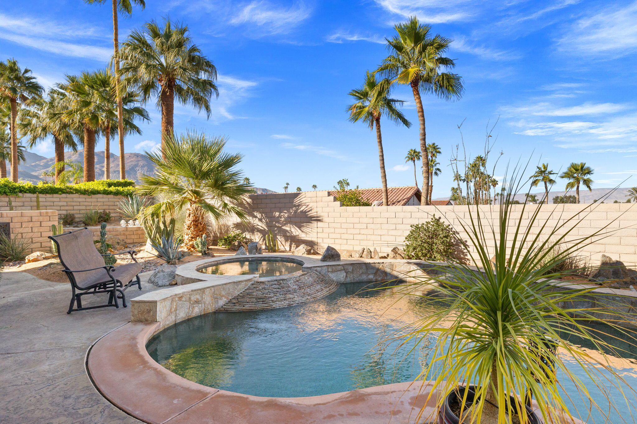 73110 Calliandra Street Palm Desert, CA 92260 - Photo 48 of 67 a view of a swimming pool with a patio