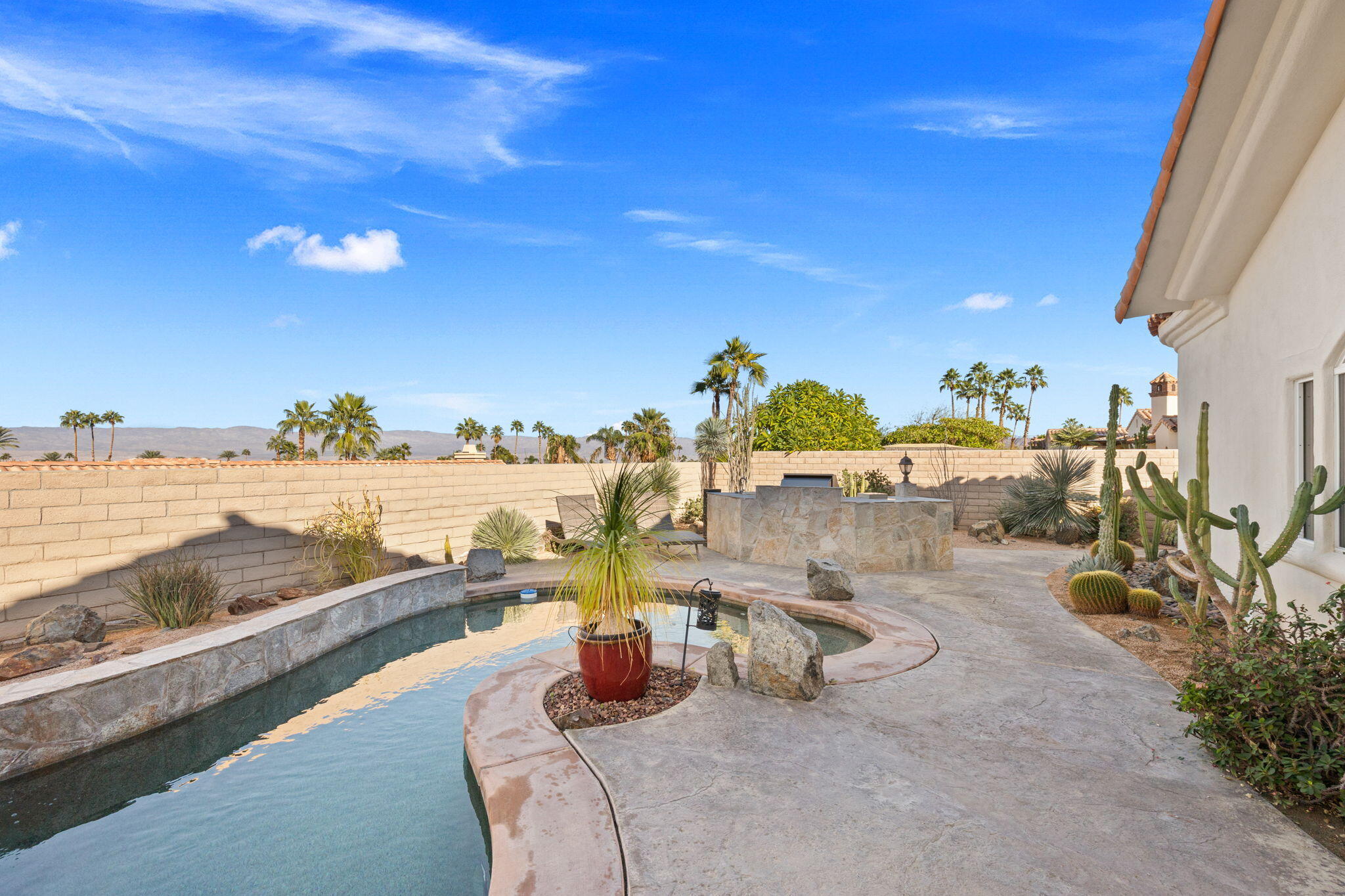 73110 Calliandra Street Palm Desert, CA 92260 - Photo 49 of 67 a view of a swimming pool with an ocean view