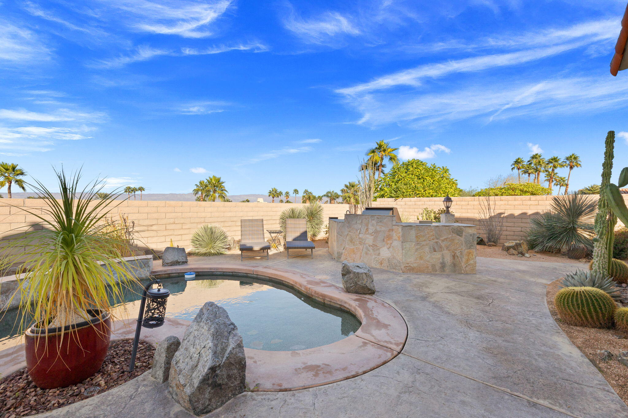 73110 Calliandra Street Palm Desert, CA 92260 - Photo 50 of 67 a view of a swimming pool with a yard