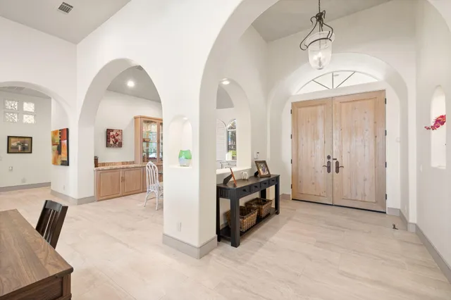 a kitchen with a dining table and chairs