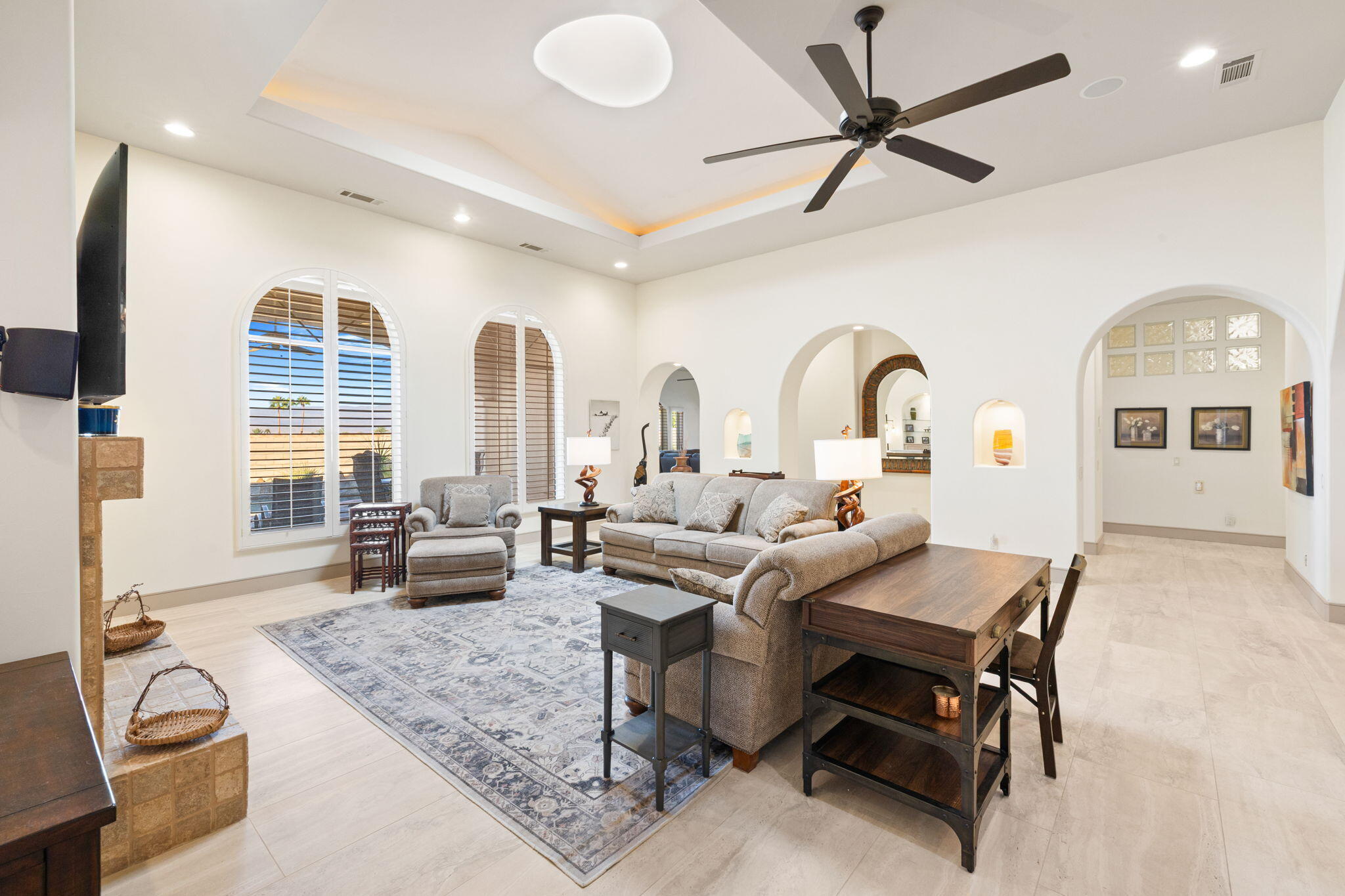 73110 Calliandra Street Palm Desert, CA 92260 - Photo 10 of 67 a living room with furniture a window and a chandelier