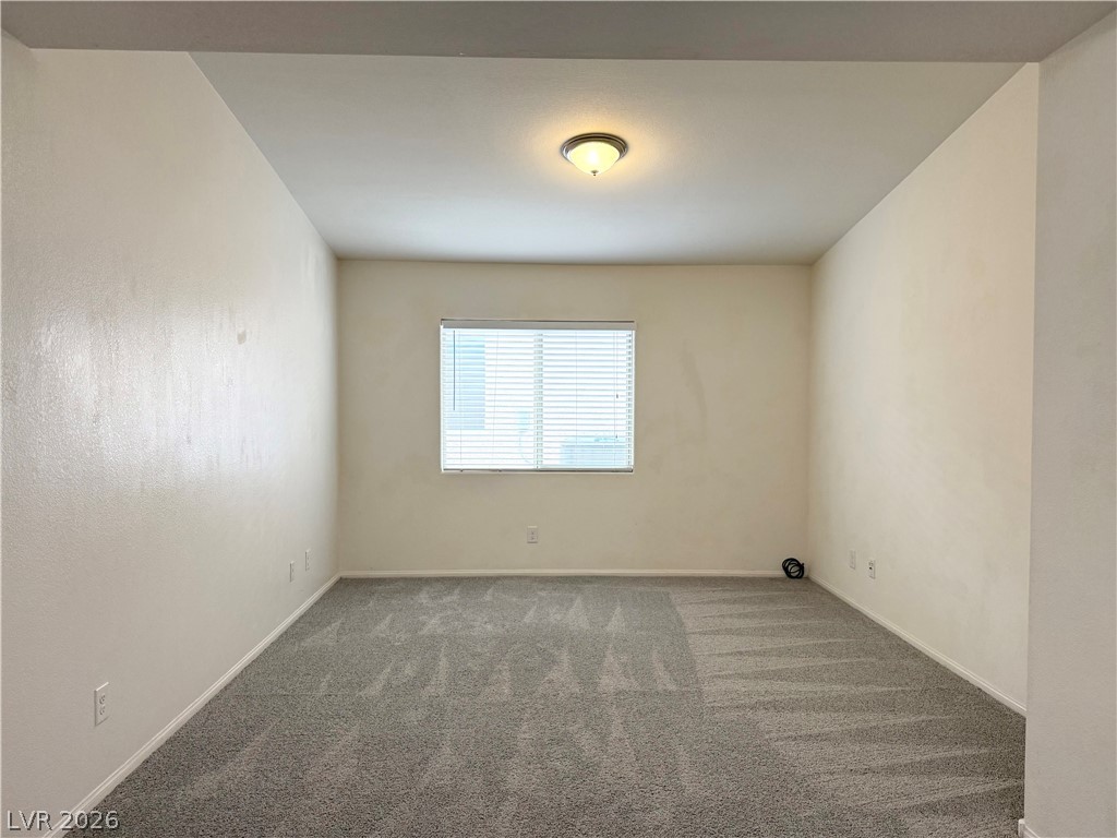 8231 Buffalo Ranch Avenue Las Vegas, NV 89147 - Photo 10 of 22 An adaptable interior space awaits your personal touch with a window providing gentle illumination.