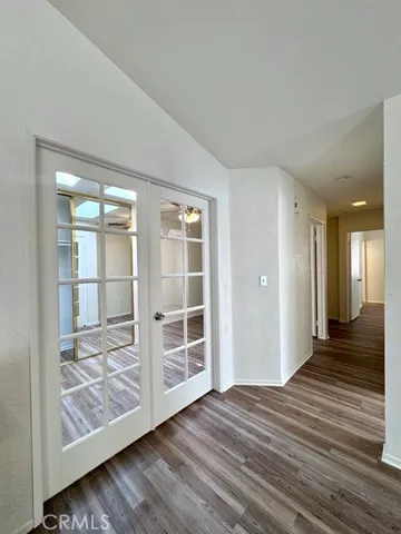 a view of wooden floor and cabinet in a room