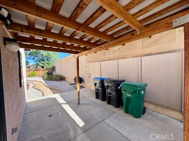 a view of a patio with table and chairs